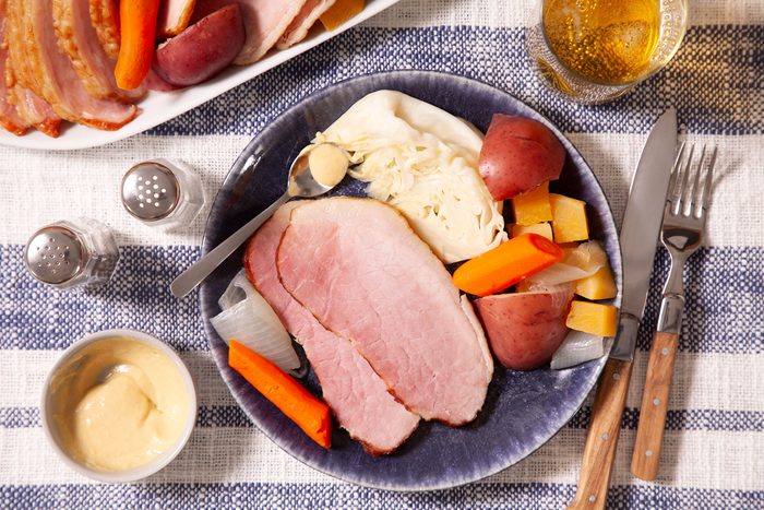 Boiled Ham Dinner served on plate with fork and knife