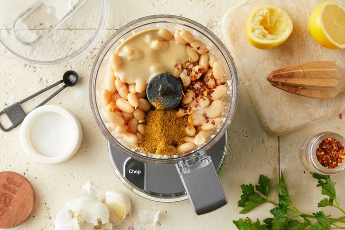 drained beans, tahini, lemon juice, cumin, salt and pepper flakes mixed in a blender