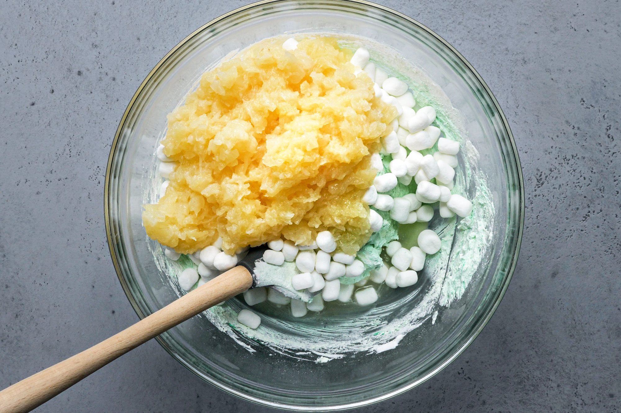 pineapple and mini marshmallows ready to be mixed in to Pistachio Mallow Salad 