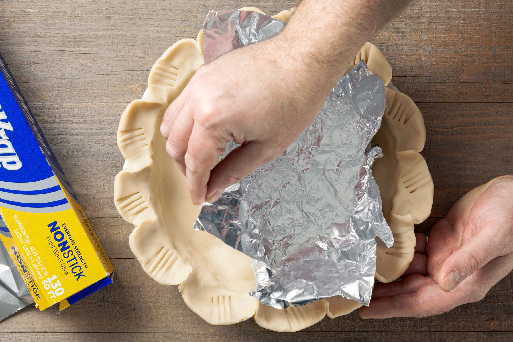 Pastry shell covered in foil paper