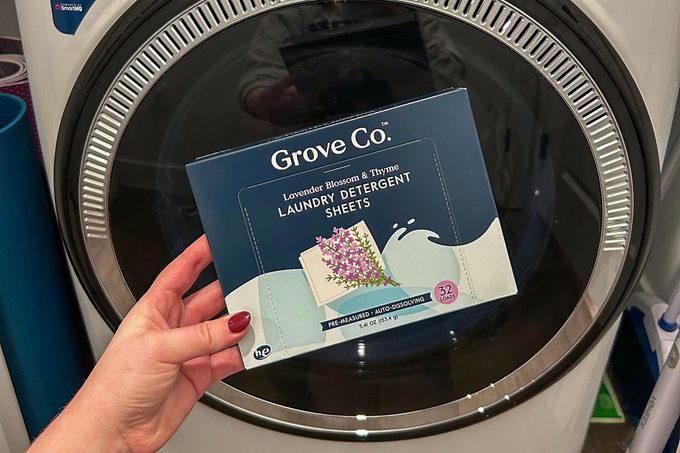 Holding box in front of a washing machine