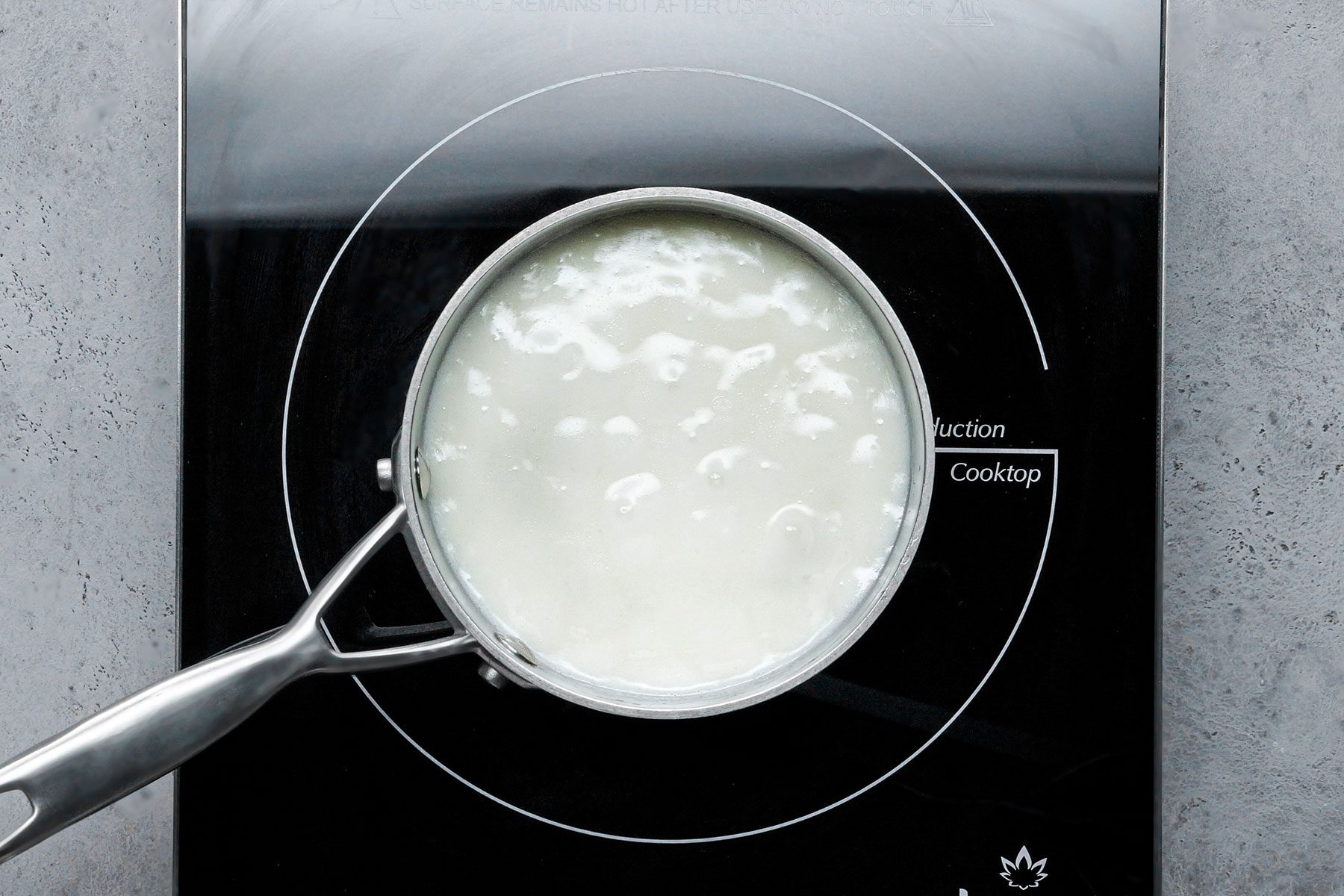 Mixing sugar and cornstarch in a sauce pan over heat