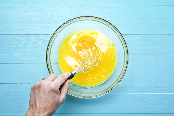 Beating eggs in a large bowl