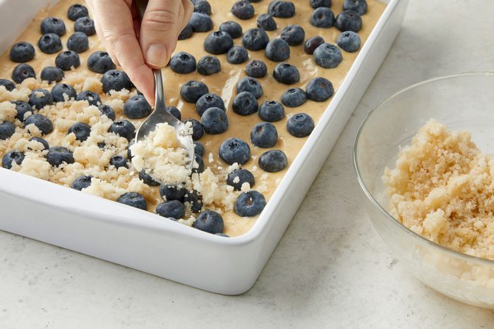 Sprinkle the streusel over the blueberries with a spoon