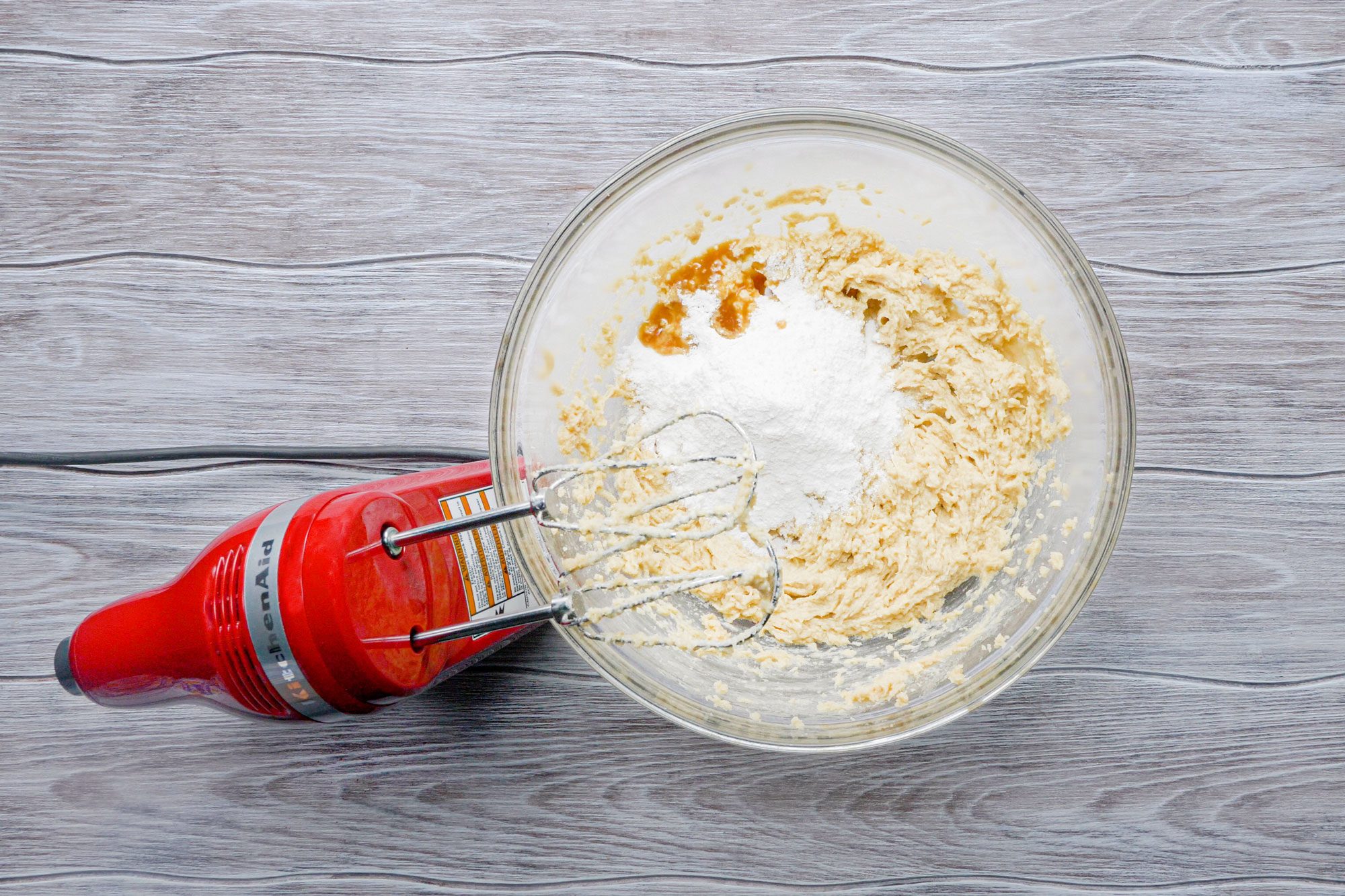 Beating the pudding mix and vanilla