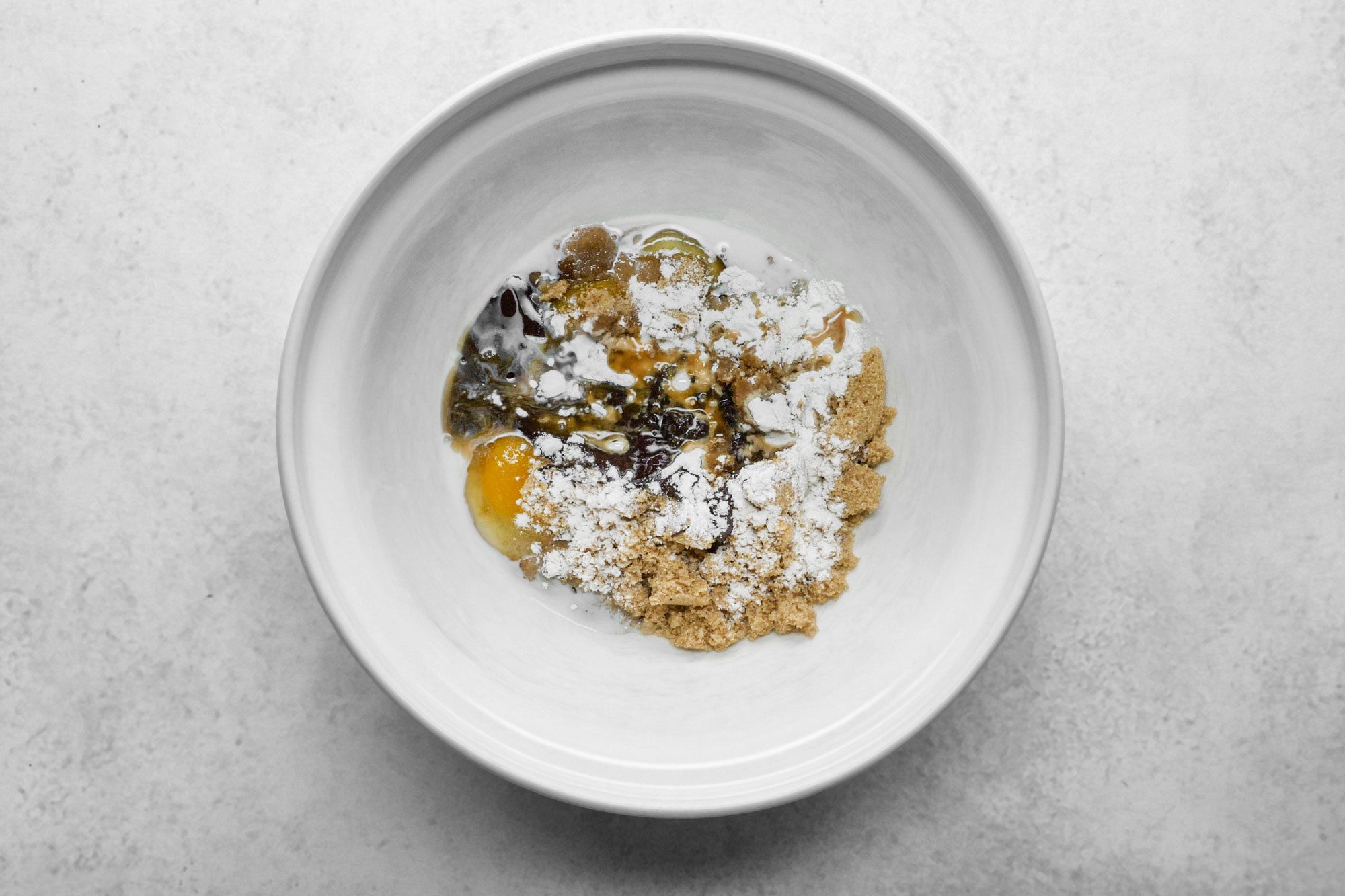 Whisk eggs, sugars, melted chocolate, milk, flour and vanilla in a large bowl together