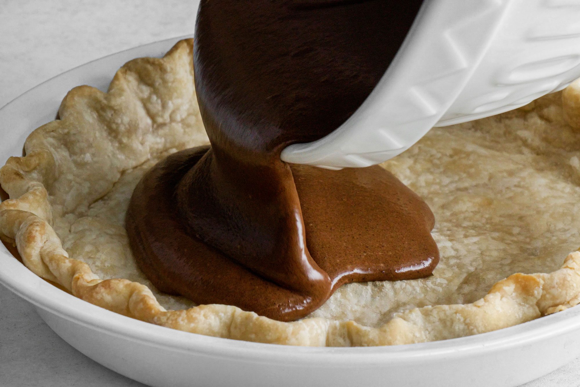 Pour the filling into the pre-baked crust