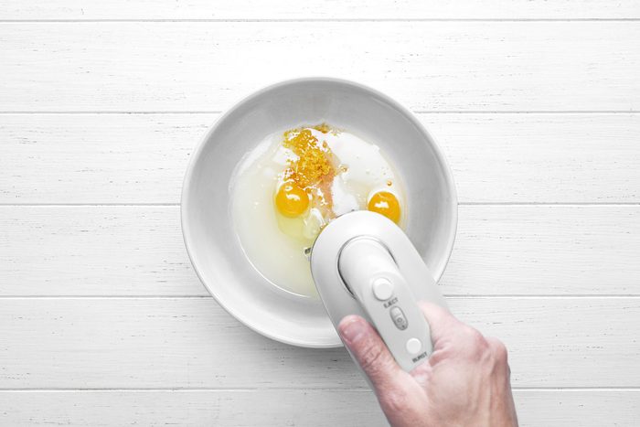 Using hand mixer beat the eggs, sugar, oil, vanilla and lemon zest