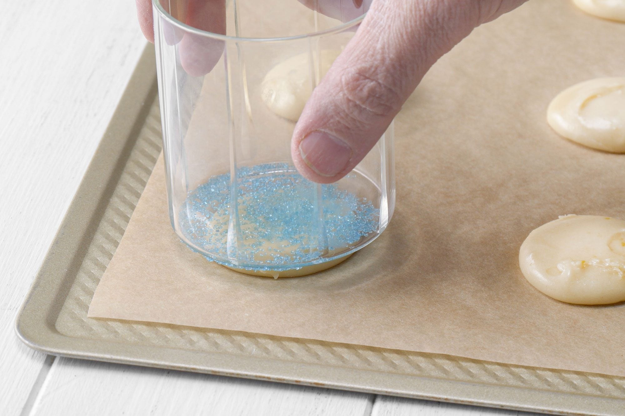 Flattening the dough with glass back side