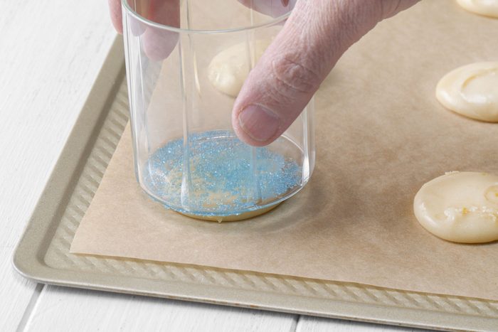 Flattening the dough with glass back side