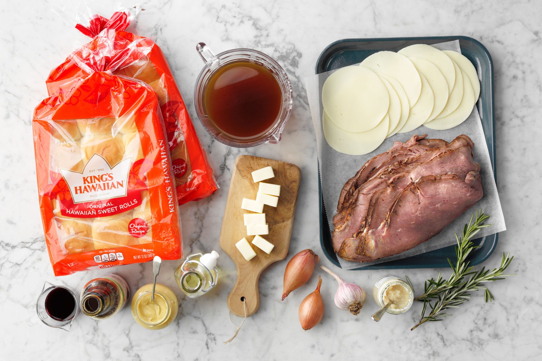 Bread cheese beef and other ingredients to make French Dip Sliders 