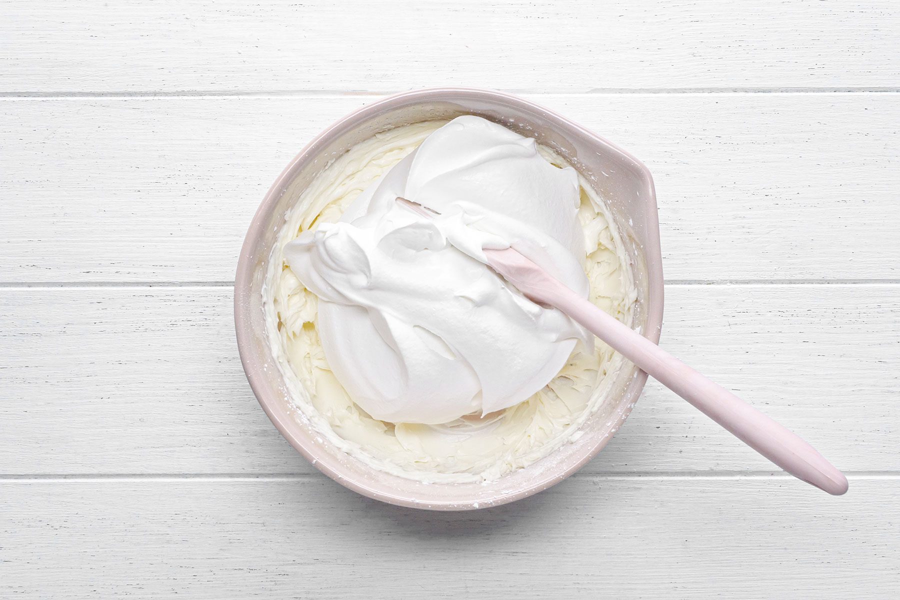 Whipping the cream cheese frosting