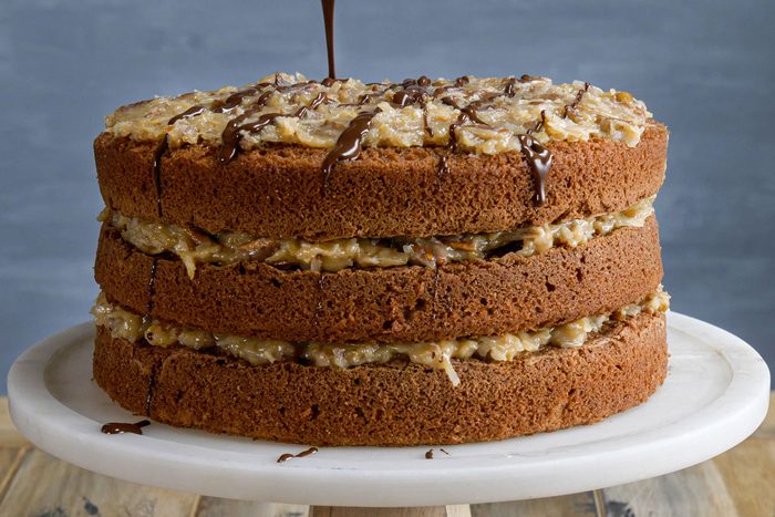 Drizzling the glaze over the cake