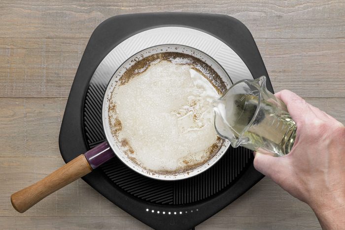 Mixing oil in a a large sauce pan