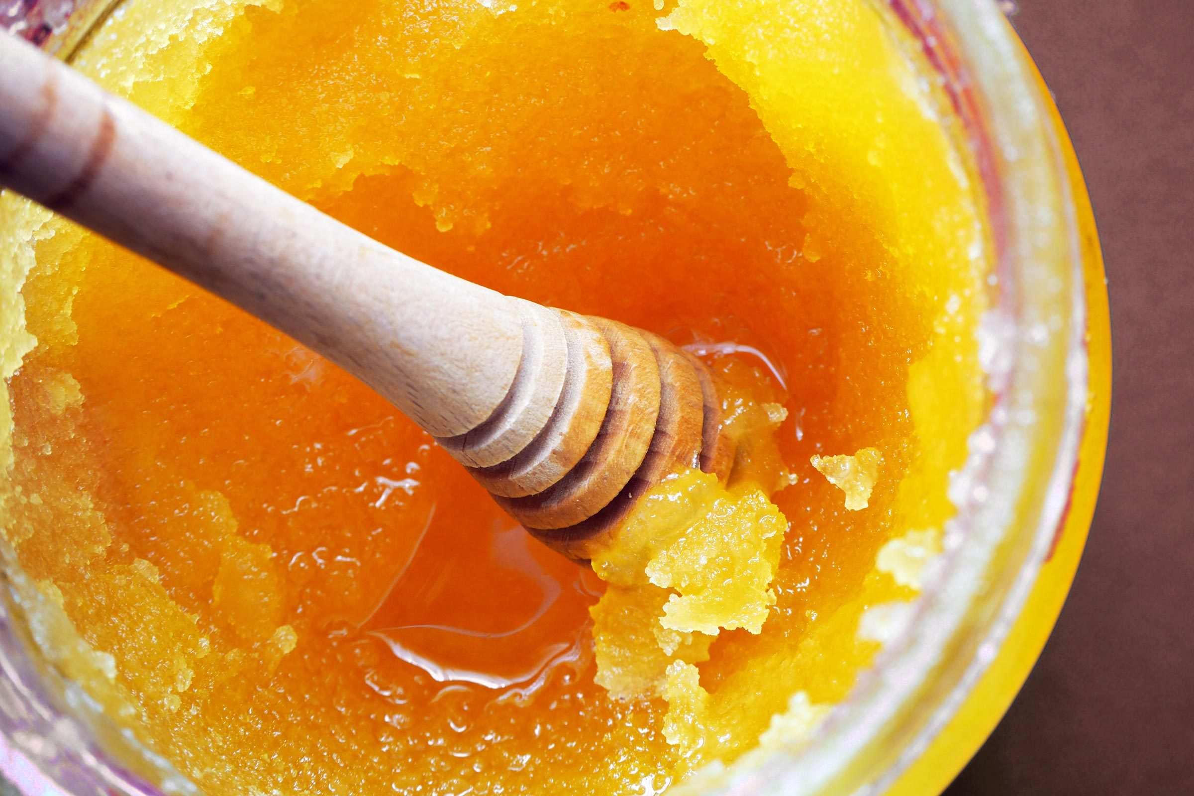 close up of crystallized honey jar