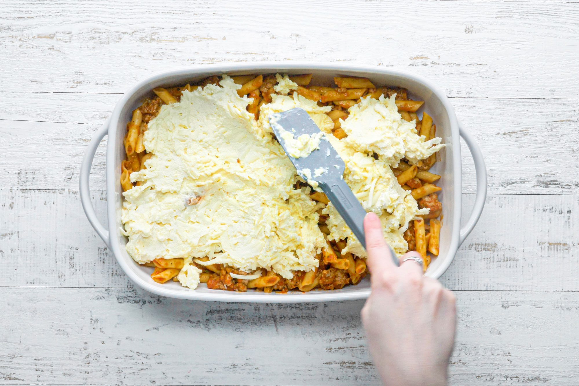 Top the pasta with the Romano cheese