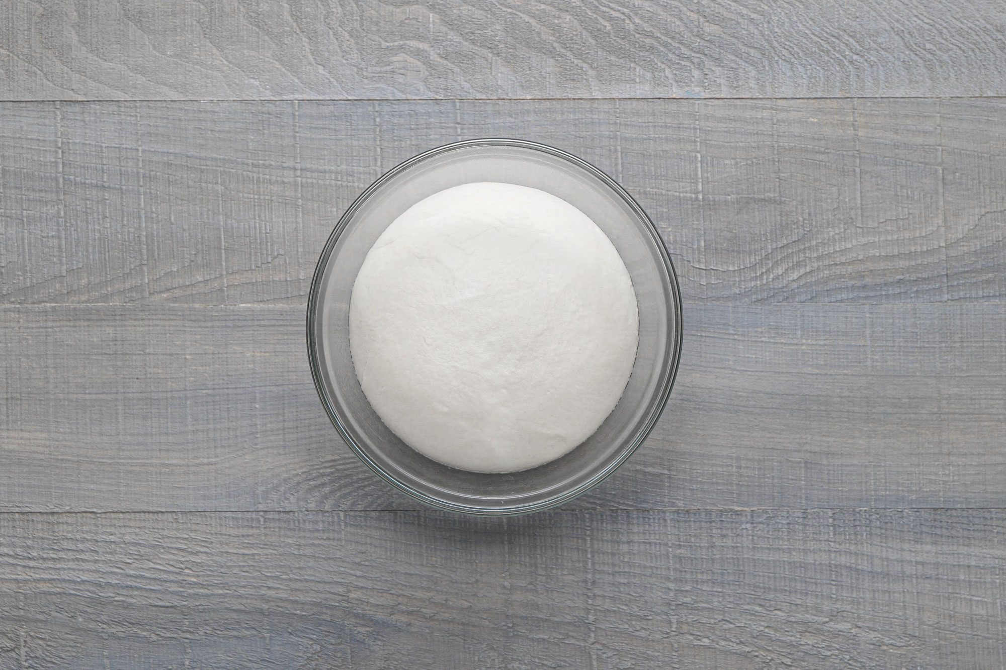 Place the dough in a bowl until it's doubled