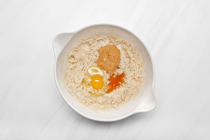 Egg, peanut butter and oats in bowl