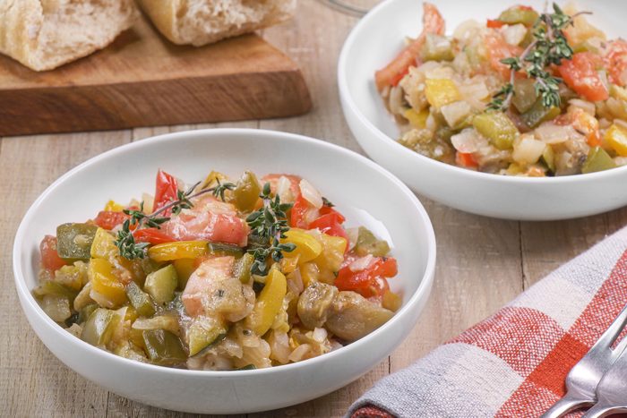 Classic Ratatouille served on two plates with knife and fork on the table
