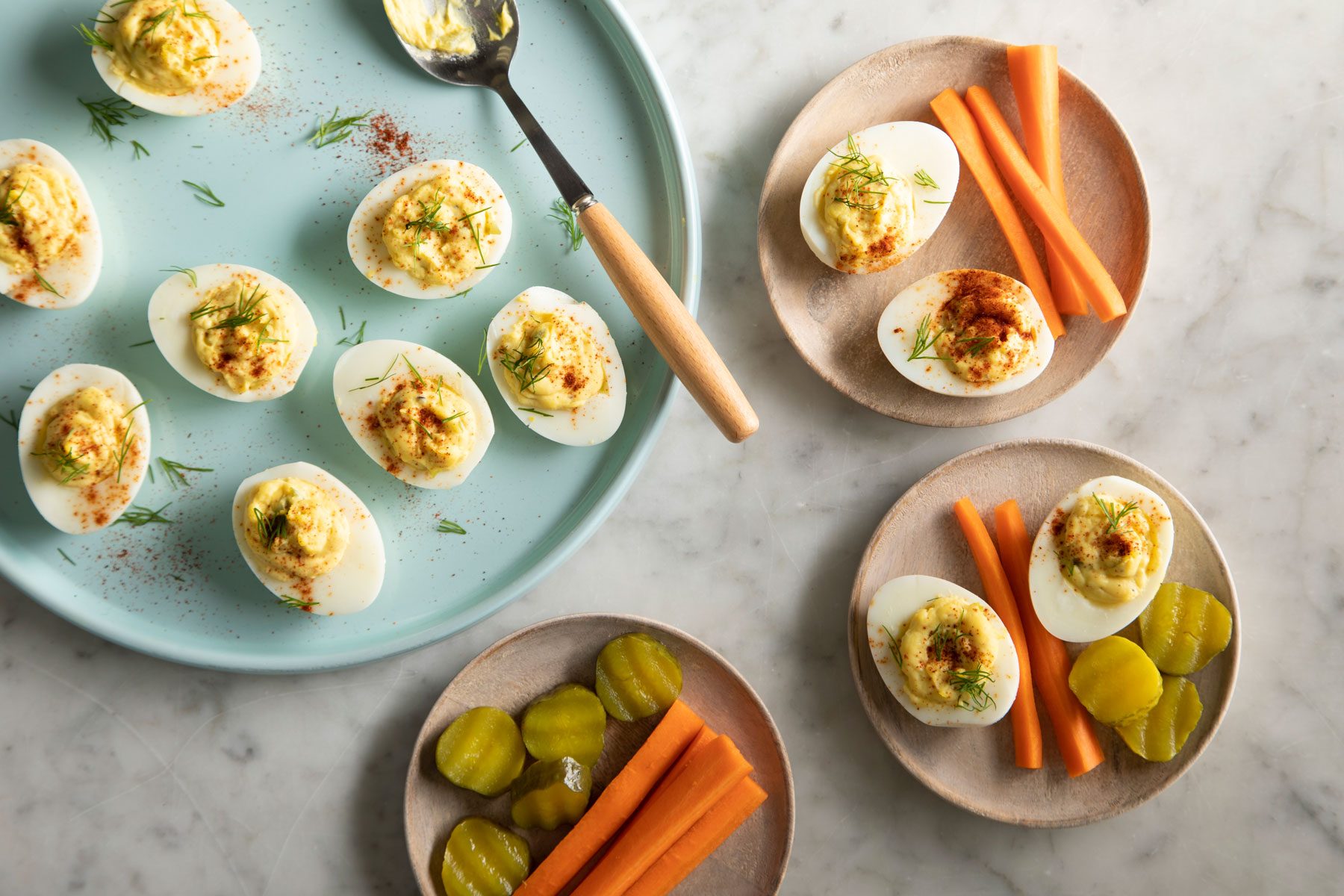 Southern Deviled Eggs served in plates with vegetables
