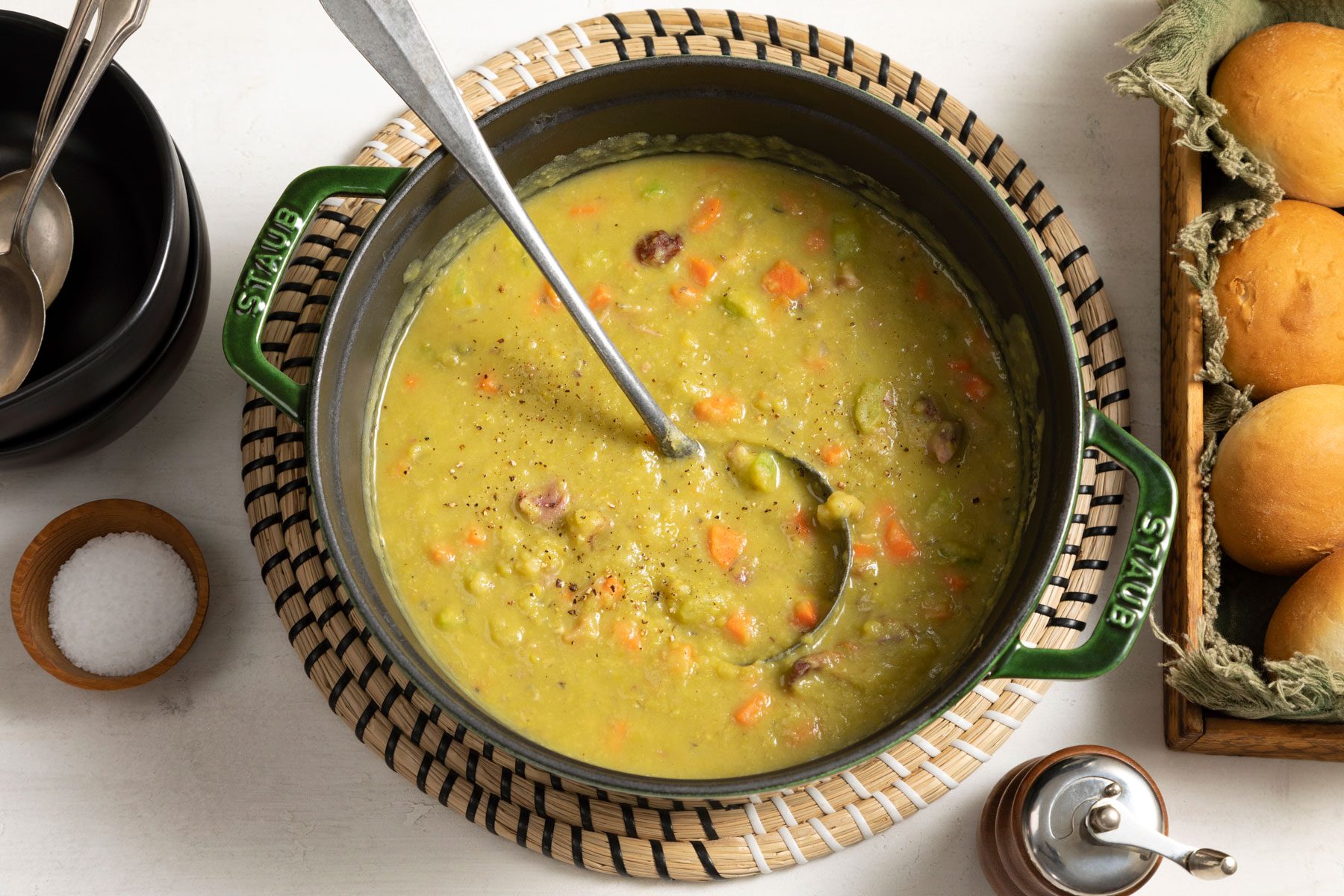 Split Pea Soup served in a large pan placed on a white surface