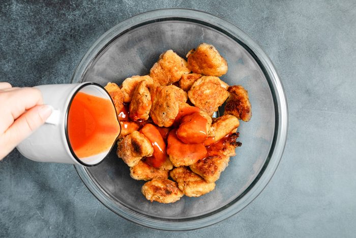 Toss the cooked chicken with the Buffalo wing sauce