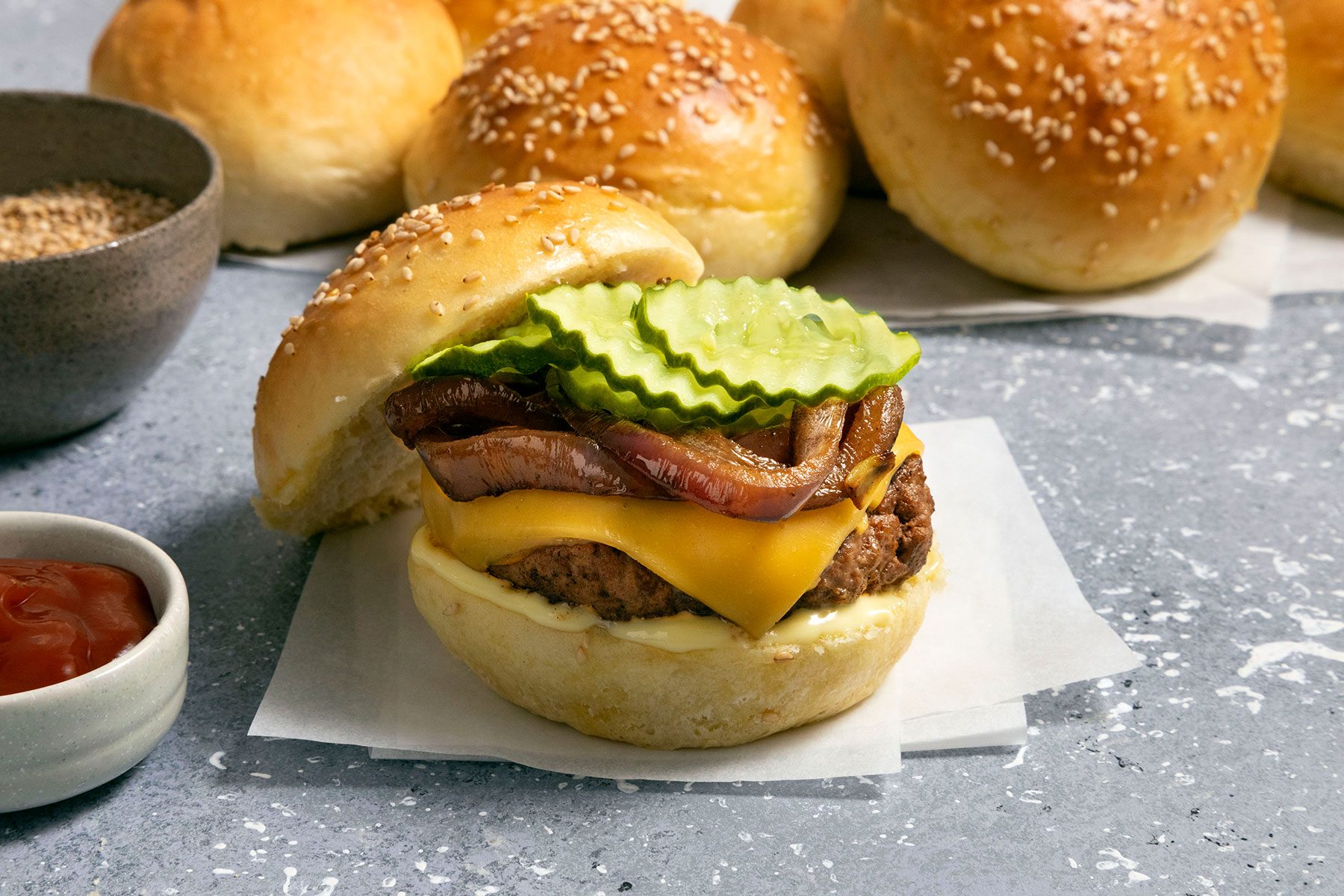 Hamburger with onions, cheese slice, patty and pickles