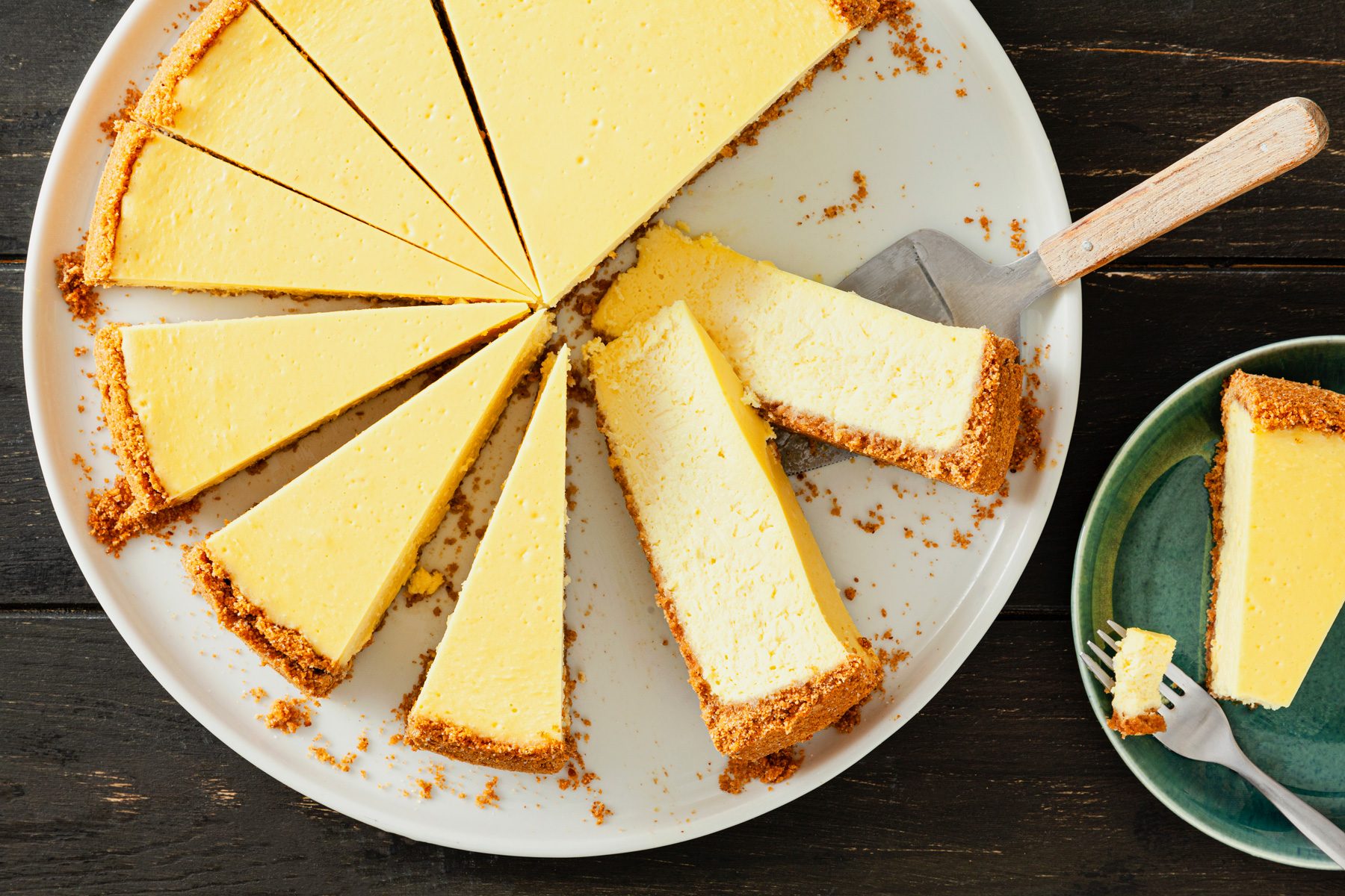 A plate of Lemon Dream Cheesecake on a wooden table