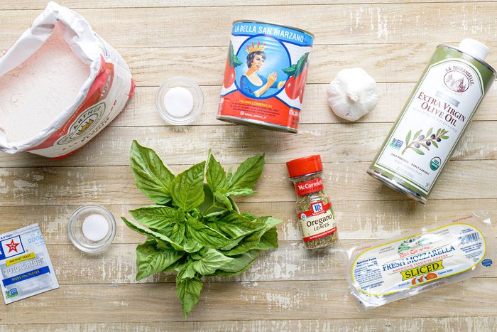 Margherita pizza ingredients on a table