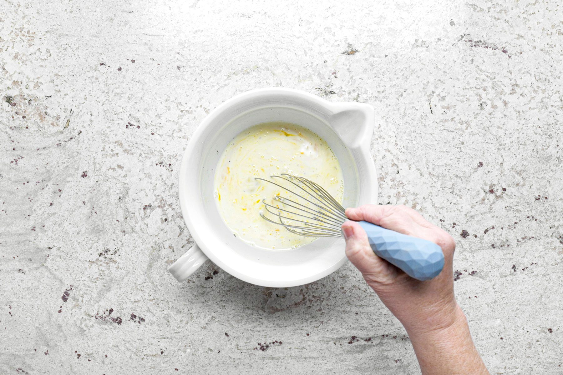 Whisking egg in container