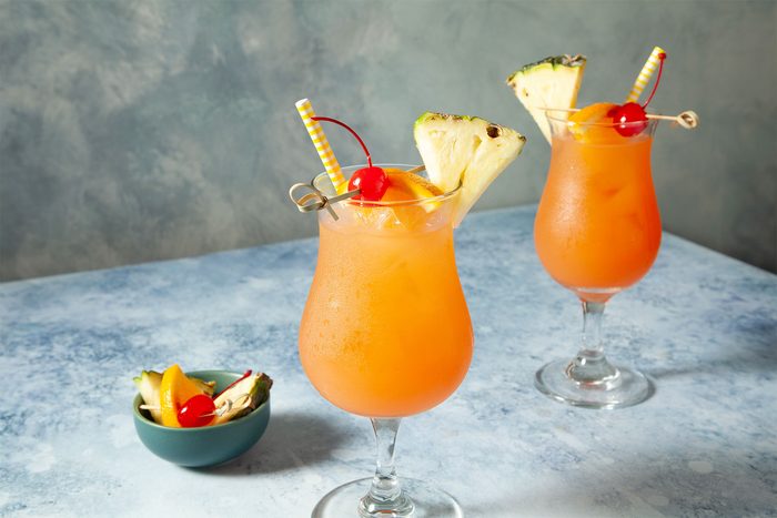 wide shot of sweet rum punch with fruits