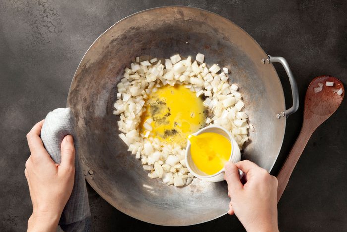 Make a well in the center of the onion mixture and add egg