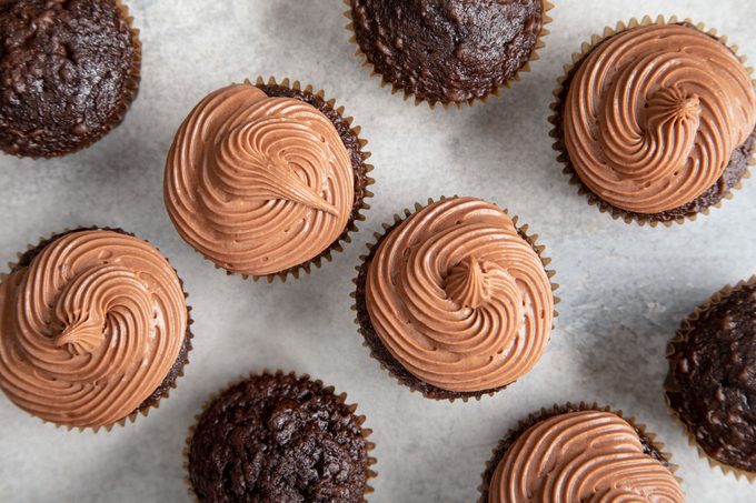 overhead view of frosted and unfrosted cupcakes