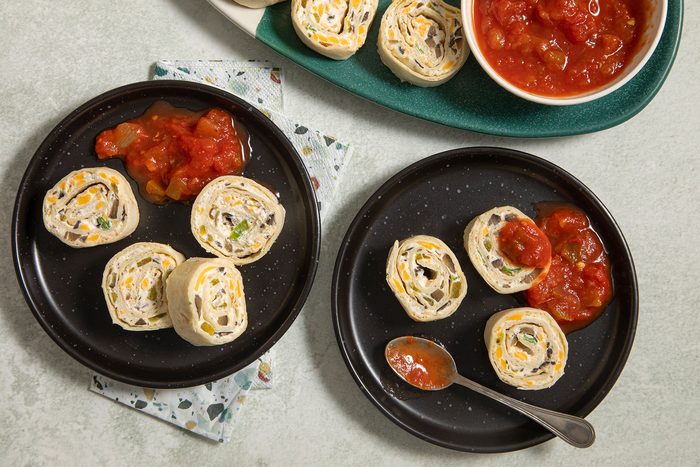 Appetizer Tortilla Pinwheels served on plates with salsa