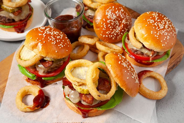A delicious Barbecue Bacon Burger topped with onion rings and cheese