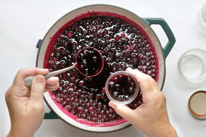 overhead shot of prepared blueberry mix transferred in small jars