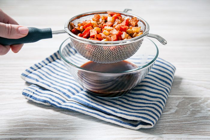 Table view shot of straining through a fine sieve