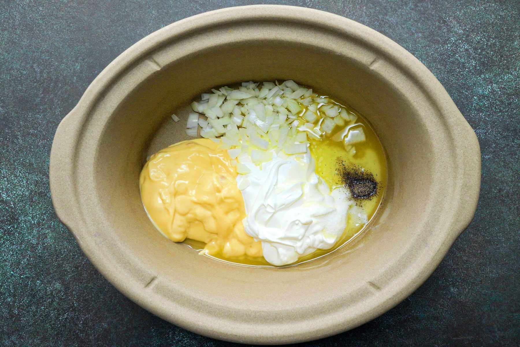 All ingredients for comforting cheesy potatoes in bowl