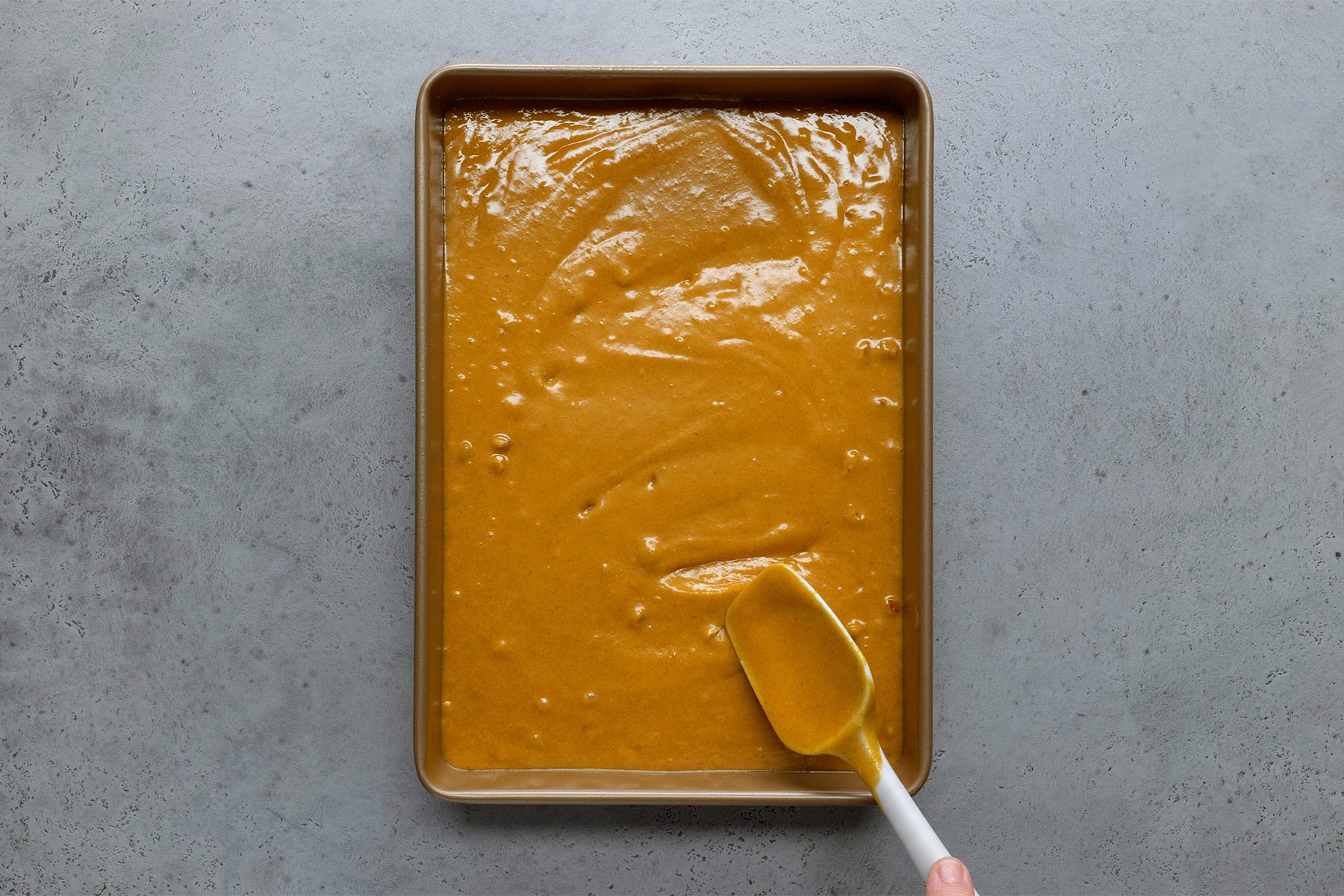 Batter transfer in to a greased baking pan