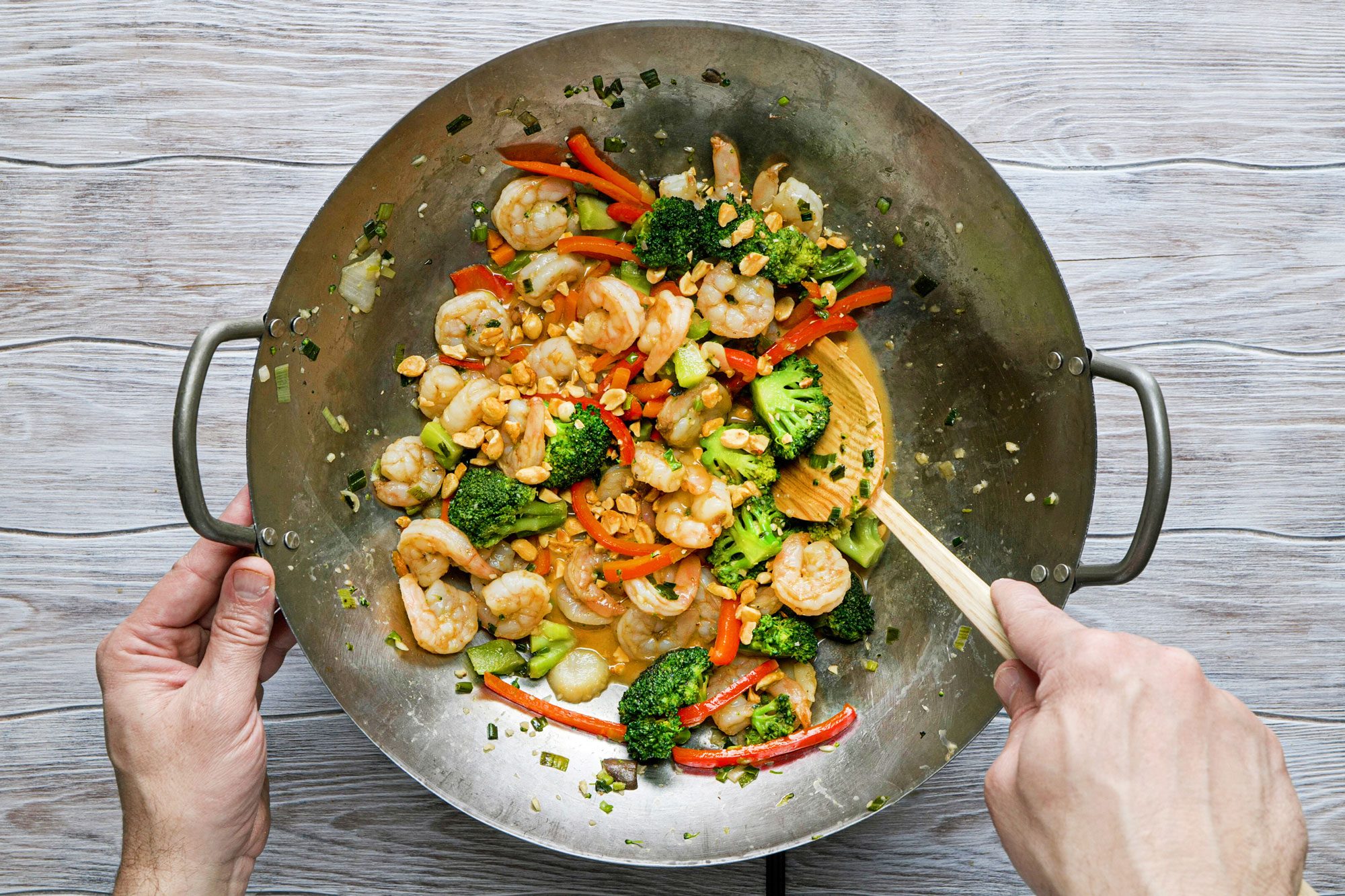 Pour the cornstarch mixture and peanuts into the shrimp stir-fry