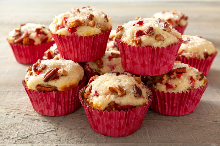 Stack of Strawberry Muffins on a Wooden Surface