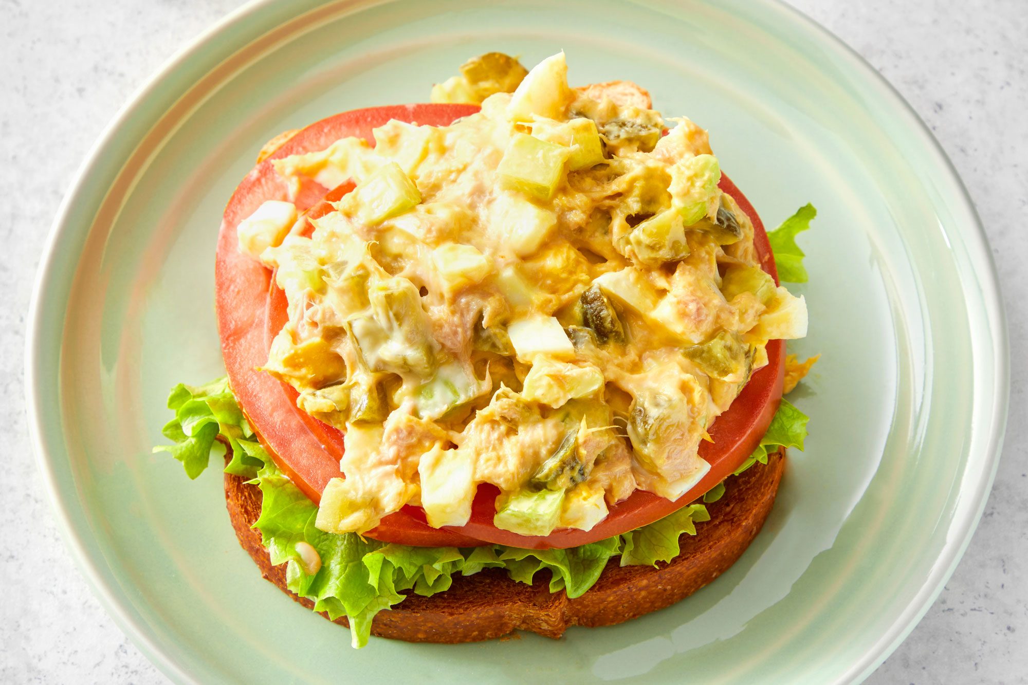 Tuna Salad With Egg and Breads served on a small plate; marble background;