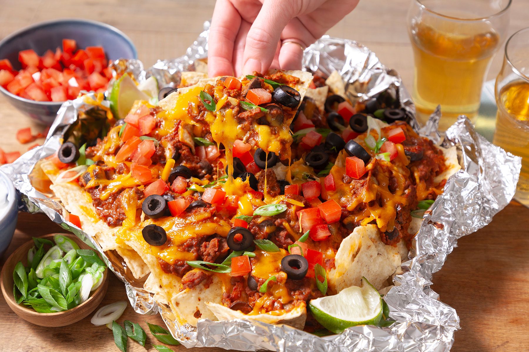 Someone picking up Air Fried Nachos