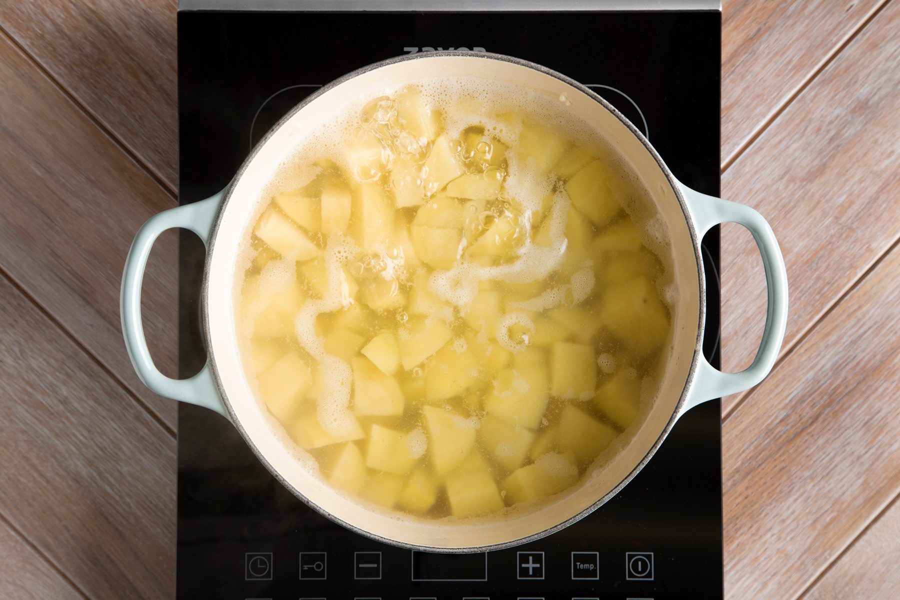 Dutch oven filled with potatoes and water