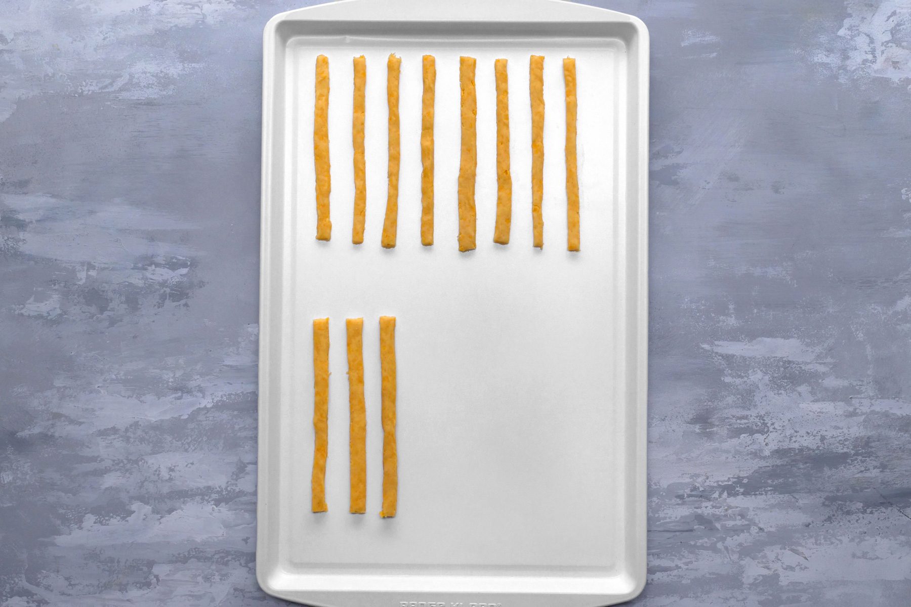 A baking sheets with cheese straws