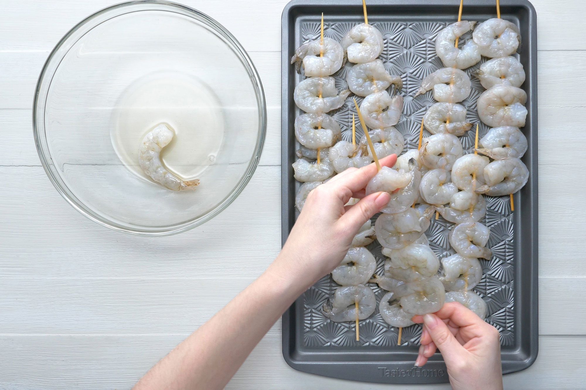 Shrimps threaded onto wooden skewers