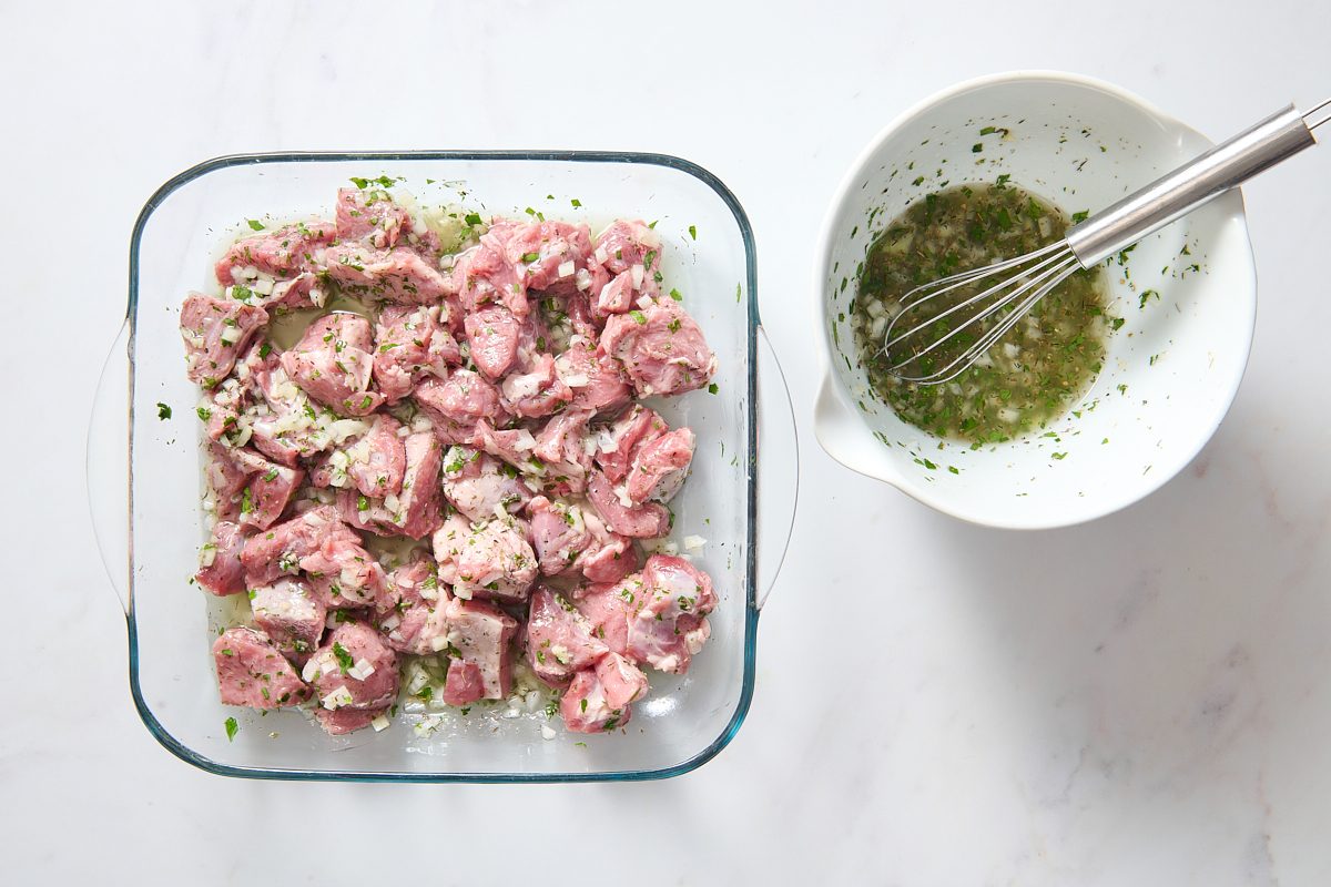 Marinating the lamb in a shallow dish