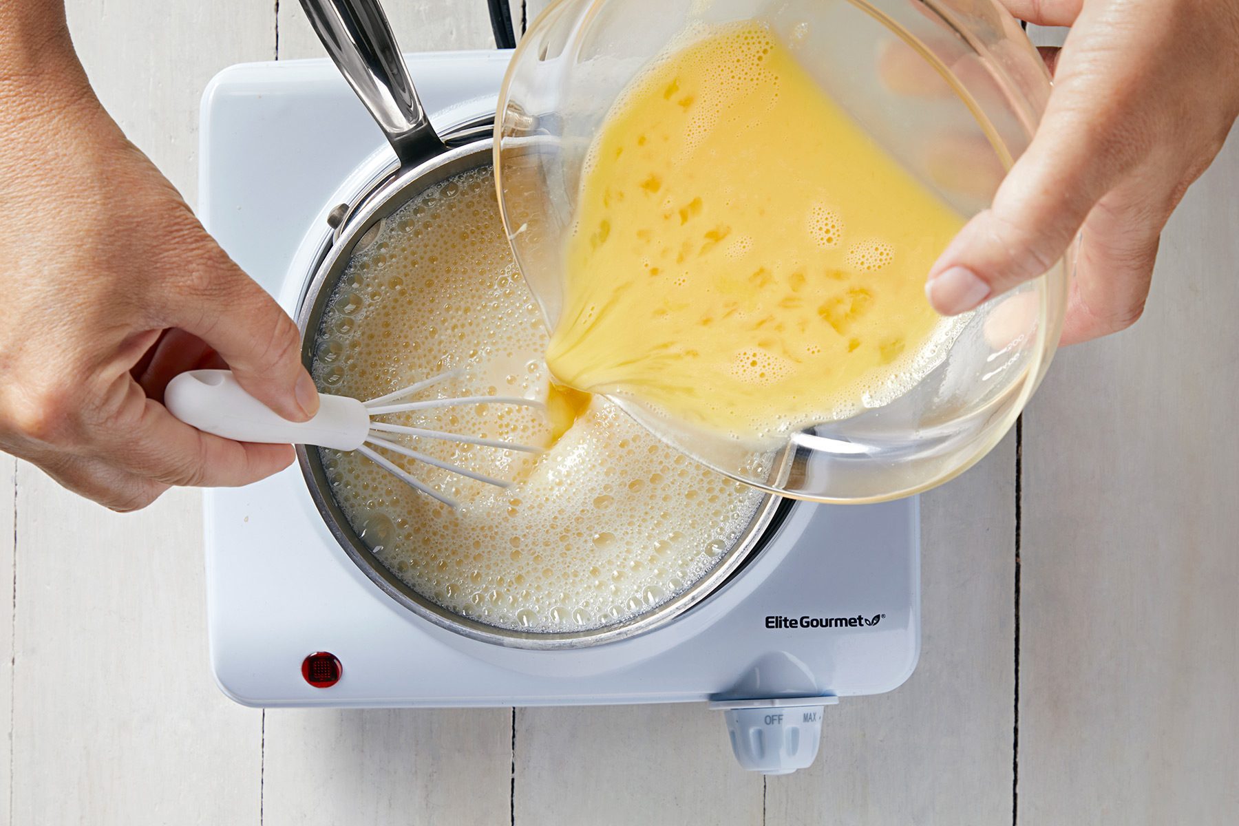 overhead shot; white background; pouring the mixture into small saucepan;