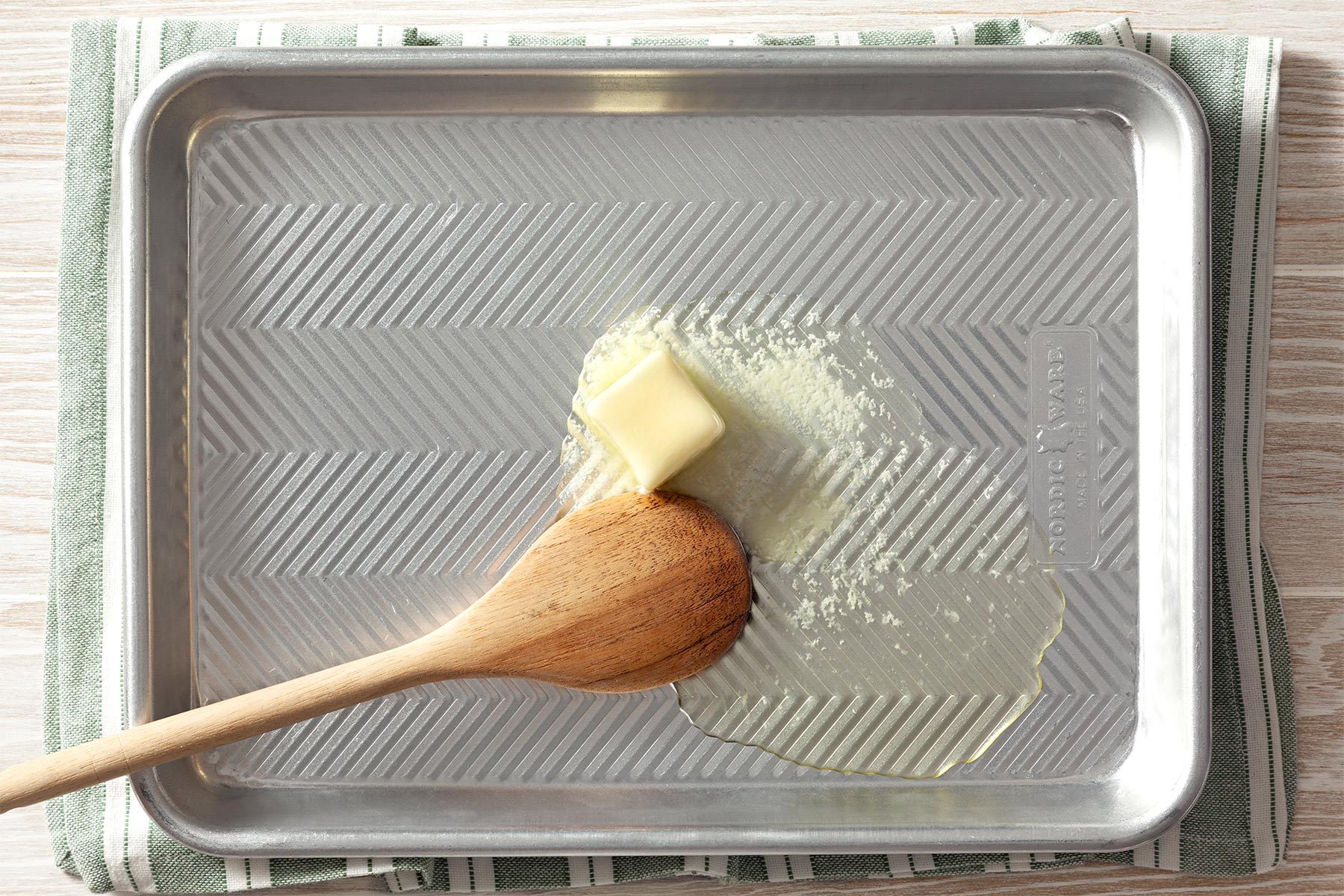 A spoon and a pan of butter