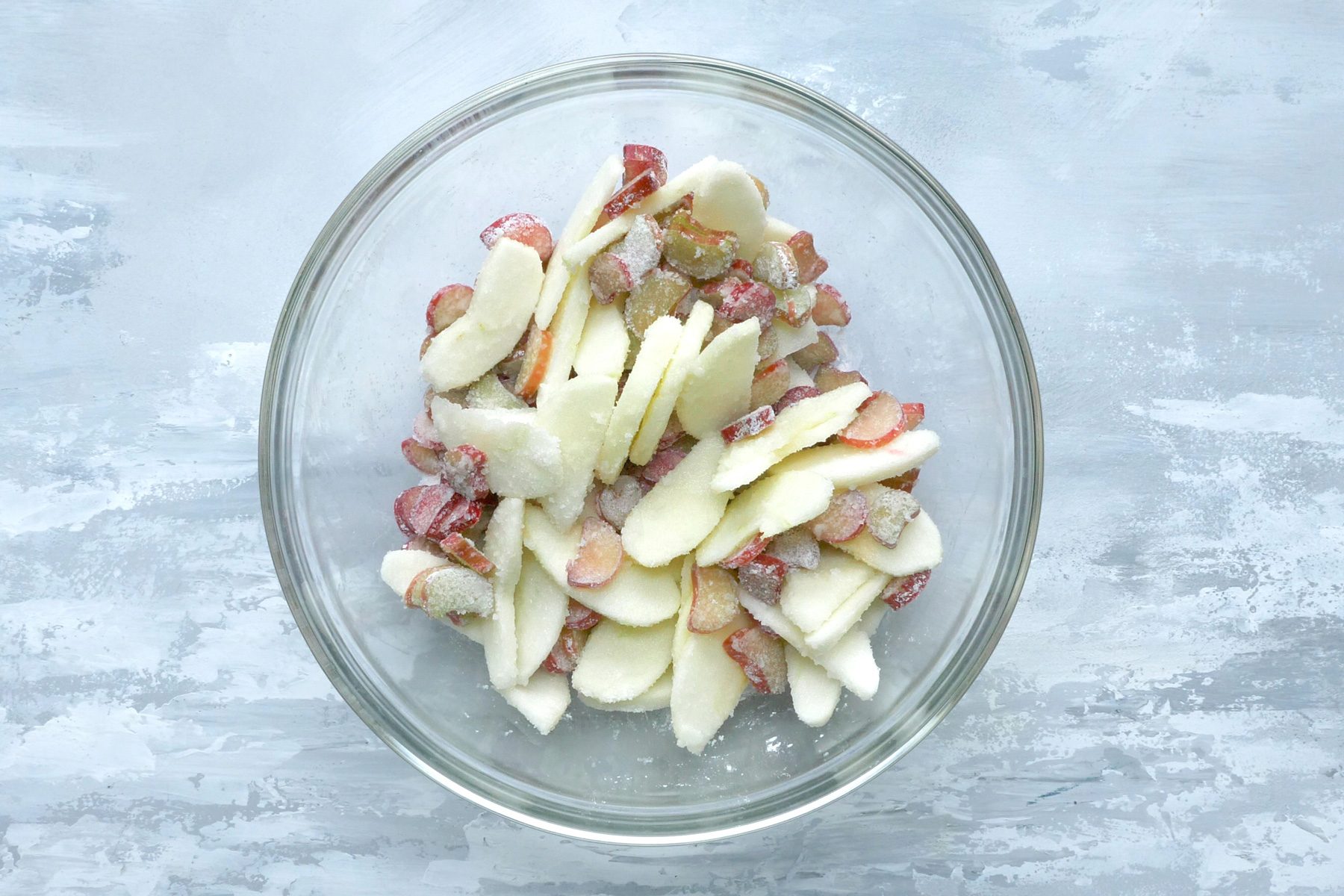 A bowl of rhubarb and apple pieces